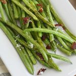 sauteed green with bacon and lemon on serving platter