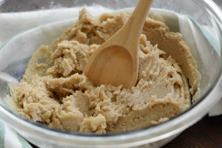mix cookie dough with wooden spoon.