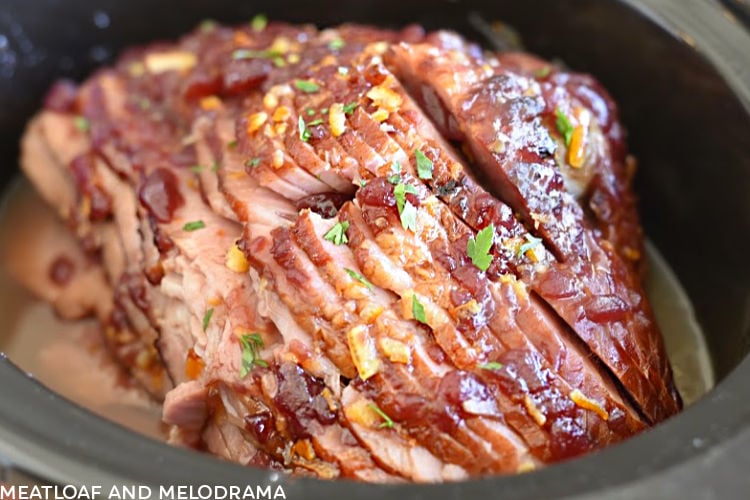 crock pot ham with jellied cranberry sauce in slow cooker