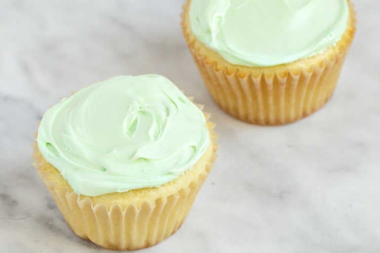 yellow cupcakes with light green frosting