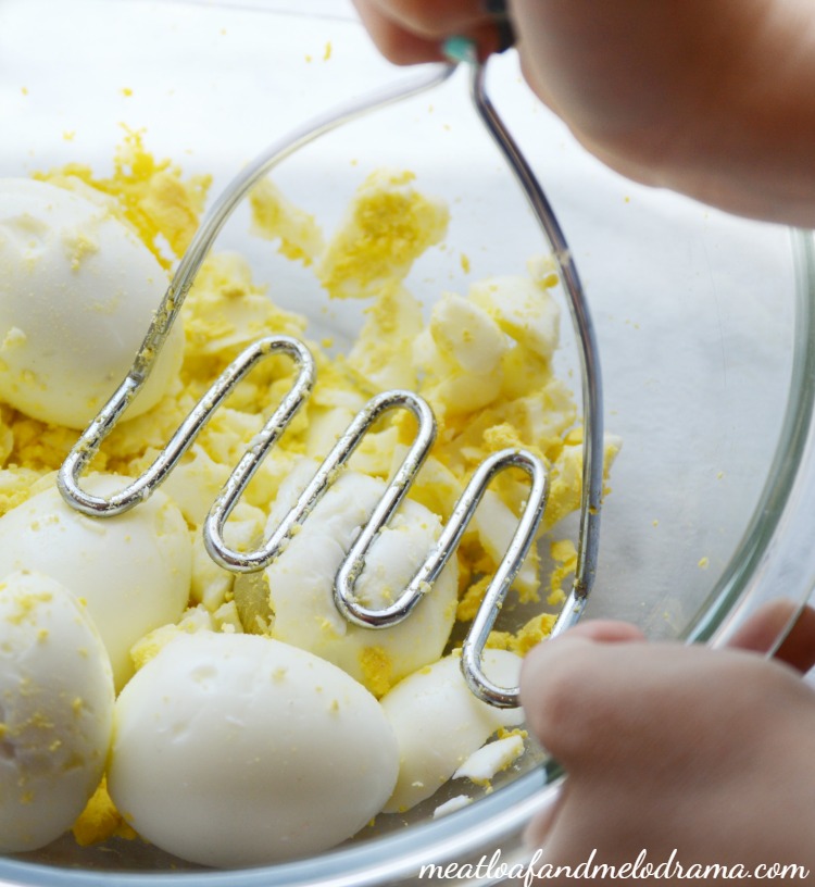 mash-eggs-with-potato-masher