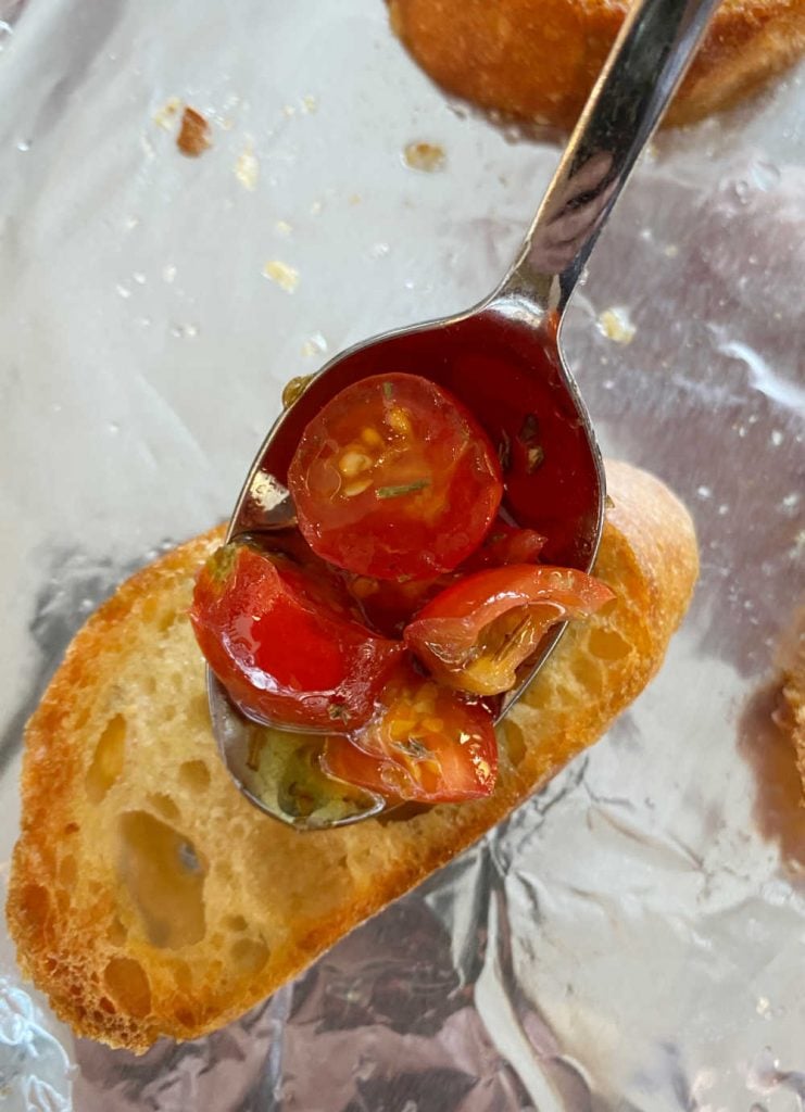spoon chopped tomatoes over toasted bread slices