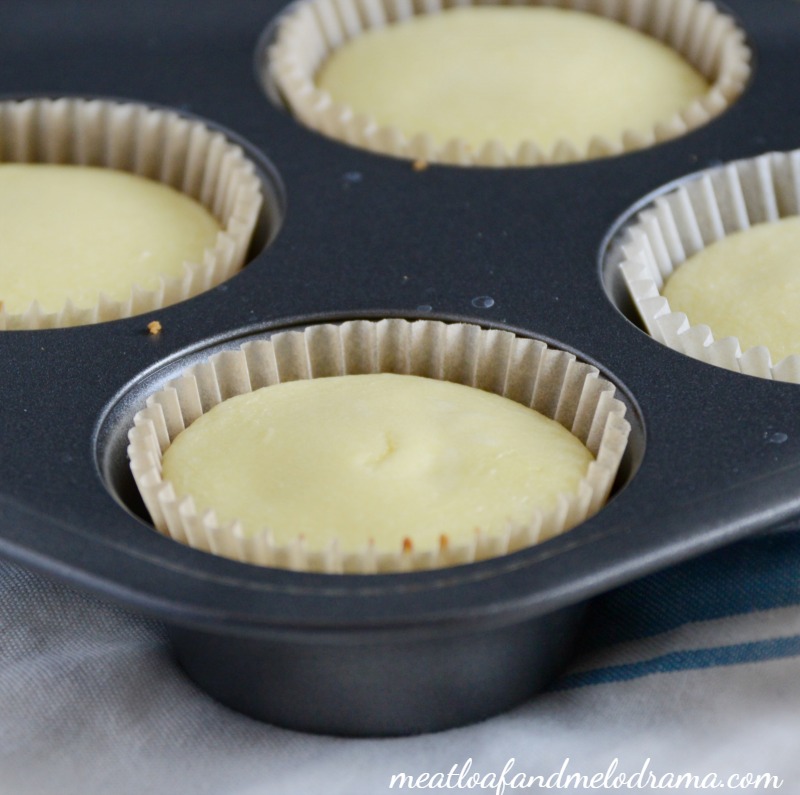 baked individual mini cheesecakes in a muffin tin