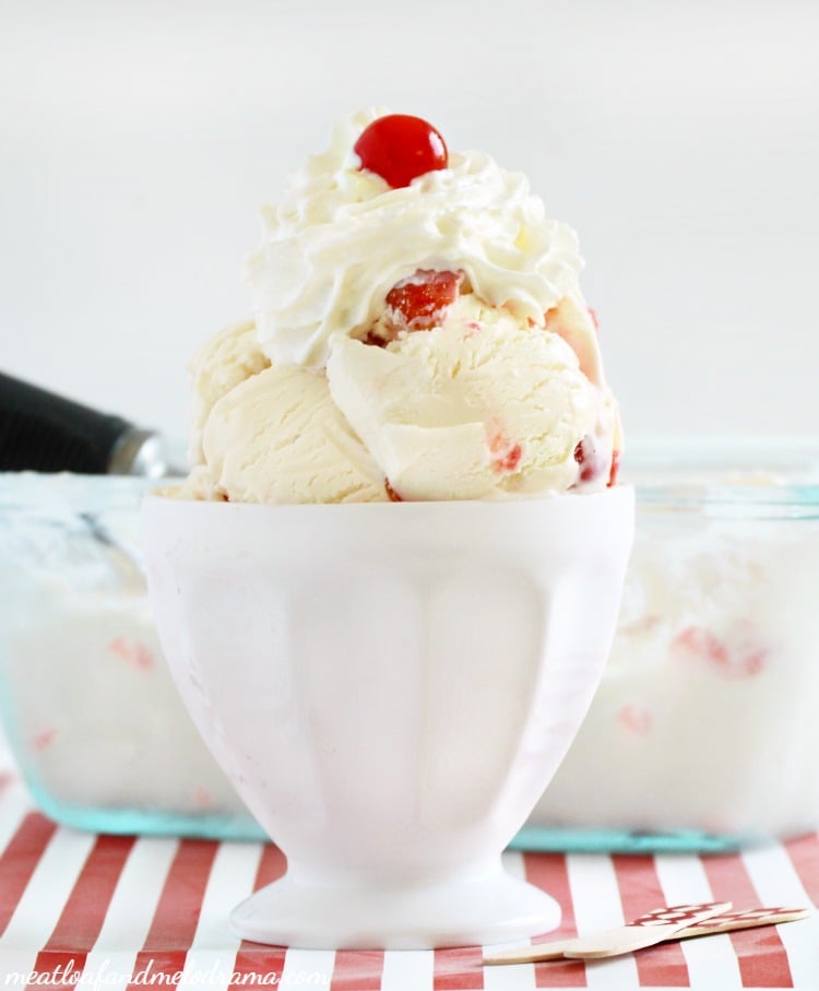 vanilla ice cream with maraschino cherries in white dish