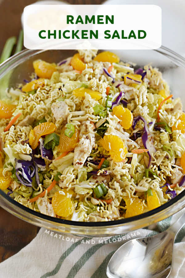 close up of ramen noodle salad with mandarin oranges in mixing bowl