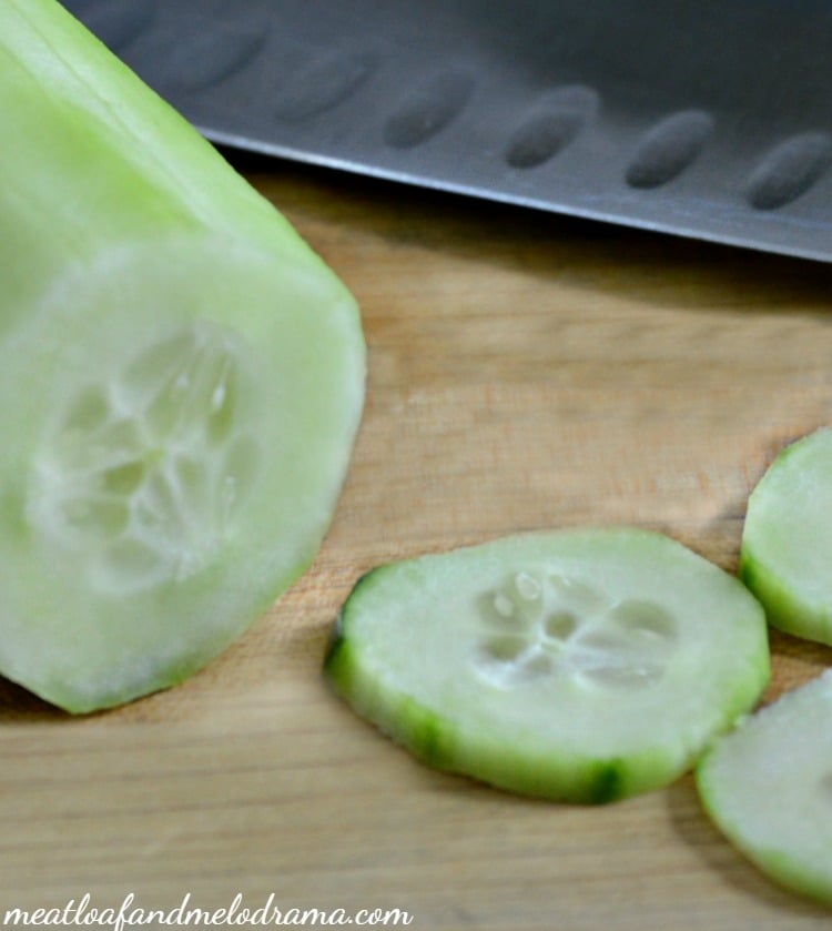 sliced cucumber on cutting board