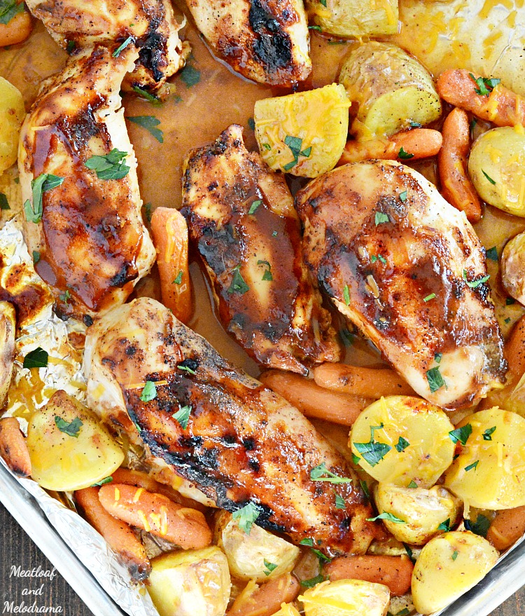 chicken with potatoes and carrots on baking sheet