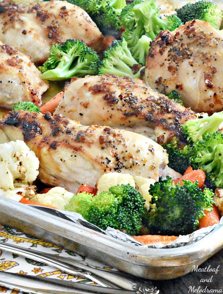 chicken and mixed vegetables on a baking sheet