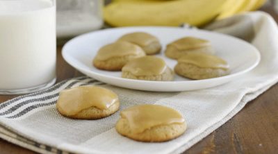 banana bread cookies with brown sugar frosting on a table and on a plate