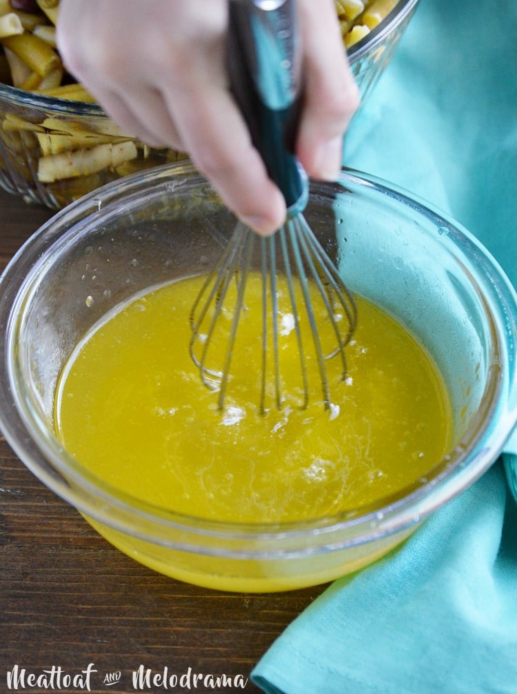 mix easy three bean salad dressing in bowl with whisk 