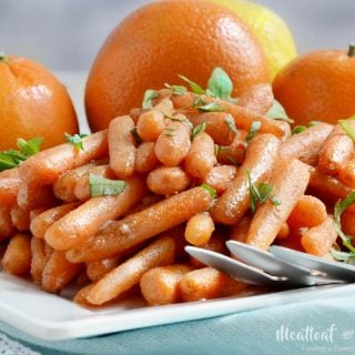 orange ginger glazed carrots on platter