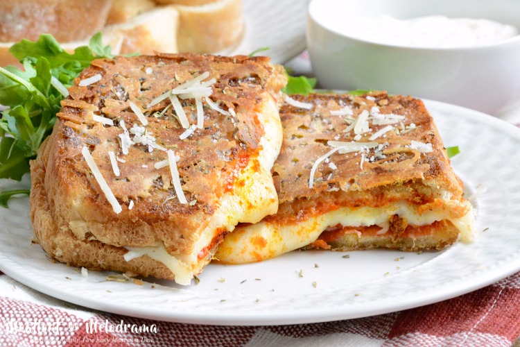Parmesan crusted pepperoni pizza grilled cheese sandwich on plate
