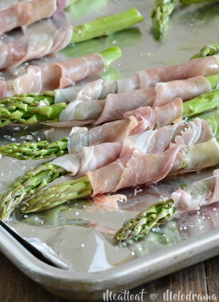 prosciutto wrapped asparagus on baking sheet