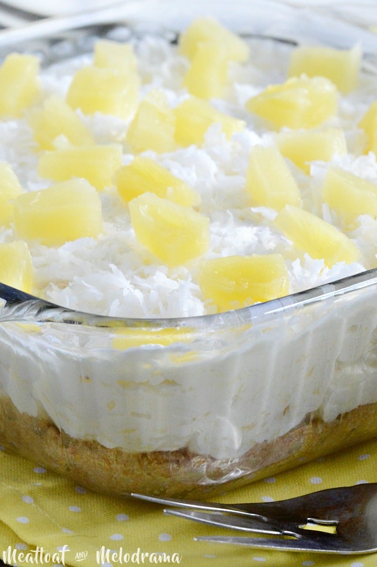 no bake pineapple dream dessert topped with pineapple and coconut in dish