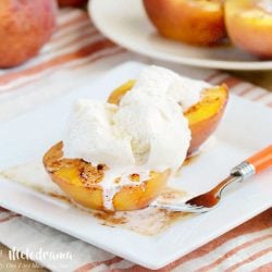 brown sugar cinnamon baked peaches on plate with ice cream