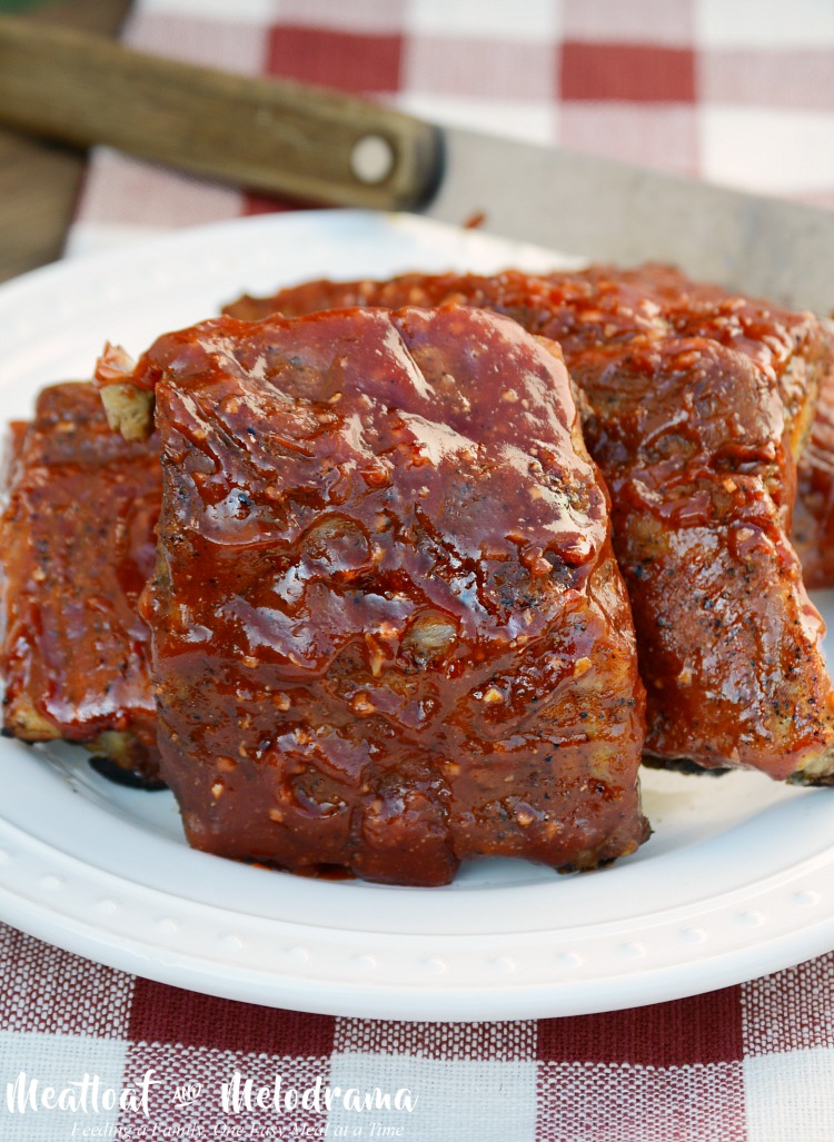 slow cooker bbq ribs with sauce on platter