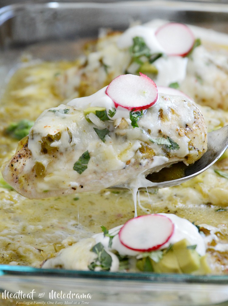 baked chicken breasts with salsa verde and pepper jack cheese in baking dish
