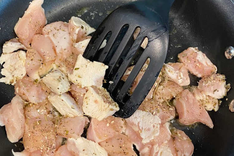 cubed chicken breasts in non stick skillet