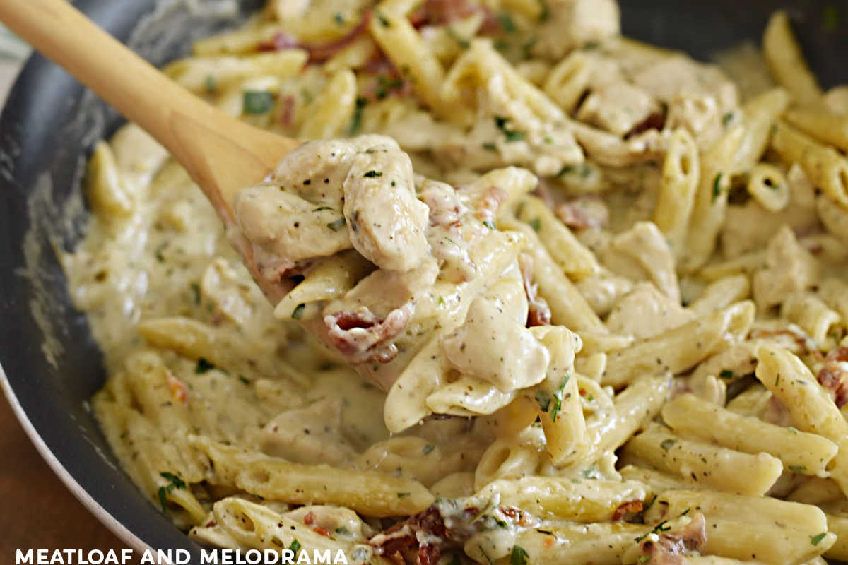 one pot chicken bacon ranch pasta on wooden spoon