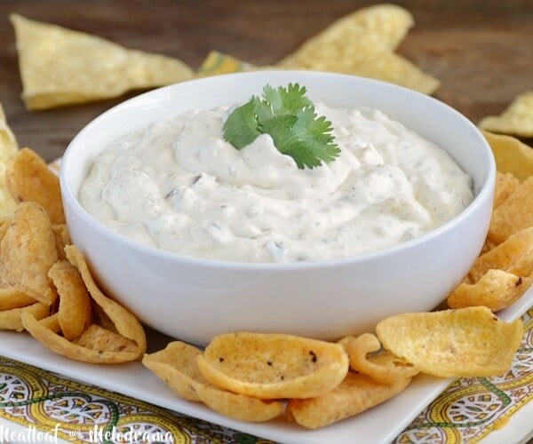 creamy salsa verde dip in bowl with chips