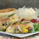 crispy salsa verde breakfast burritos with sausage eggs and peppers