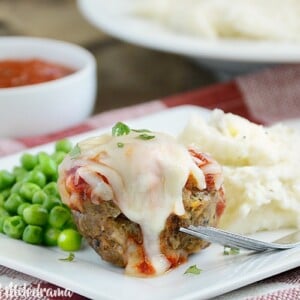 Italian meatloaf muffins with marinara sauce and provolone cheese on a plate