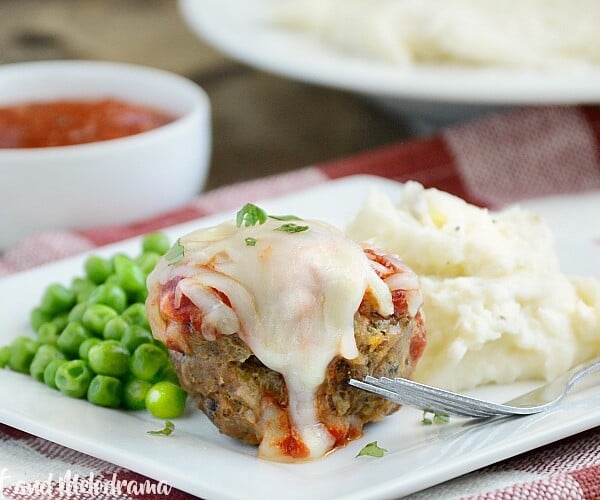 Italian meatloaf muffins with marinara sauce and provolone cheese on a plate
