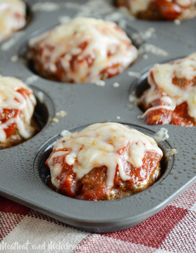Italian meatloaf muffins baked in muffin tin with pasta sauce and mozzarella