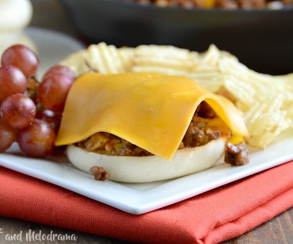 open faced sloppy joes with cheddar cheese on english muffins