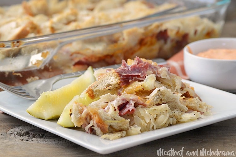easy baked reuben casserole on a plate with pickles