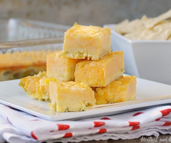 green chile cheese squares appetizer on a white square plate