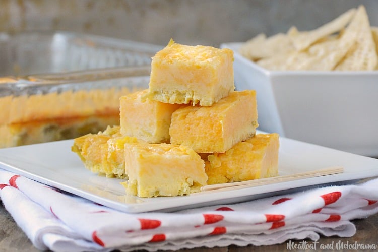 green chile cheese squares appetizer on a white square plate