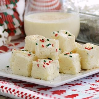 fantasy eggnog fudge on plate with eggnog
