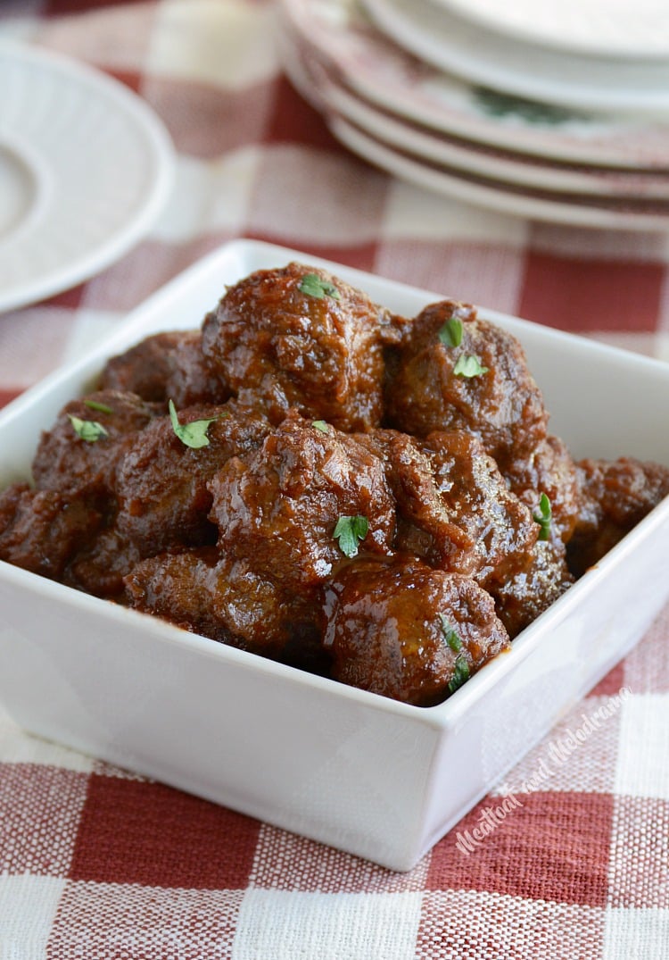 homemade cocktail party meatballs in a white square bowl