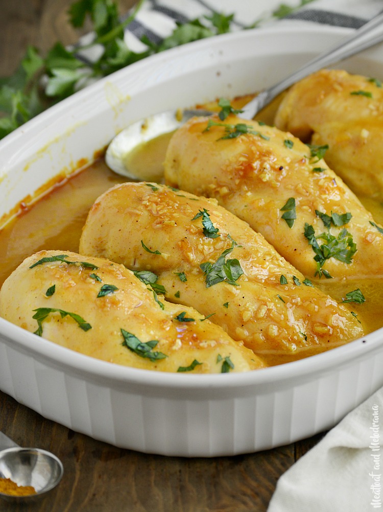 honey mustard curry chicken with parsley in serving dish