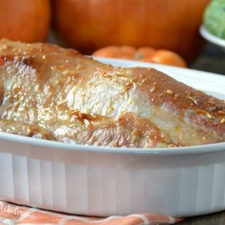 maple mustard pork roast in white baking dish