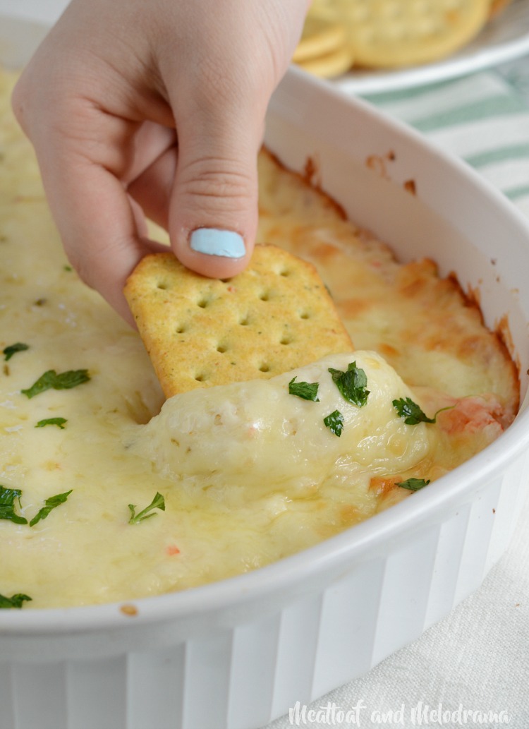 cheesy hot crab dip with parsley on top