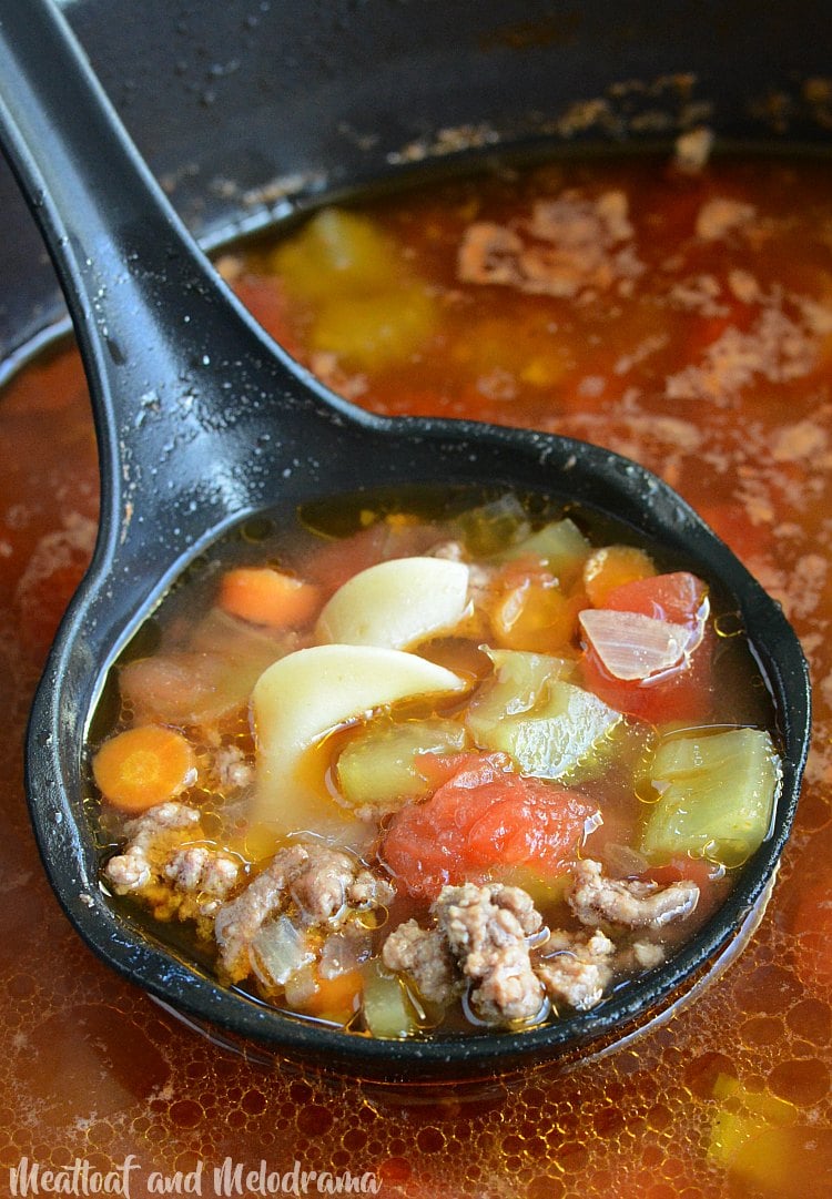 ground beef noodle soup in ladle
