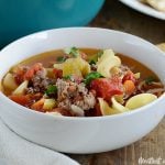 ground beef noodle soup in white bowl