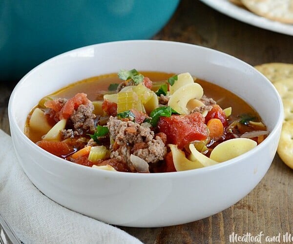 ground beef noodle soup in white bowl