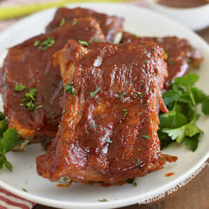 instant pot baby back ribs with bbq sauce on a white plattter