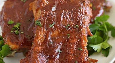 instant pot baby back ribs with bbq sauce on a white plattter