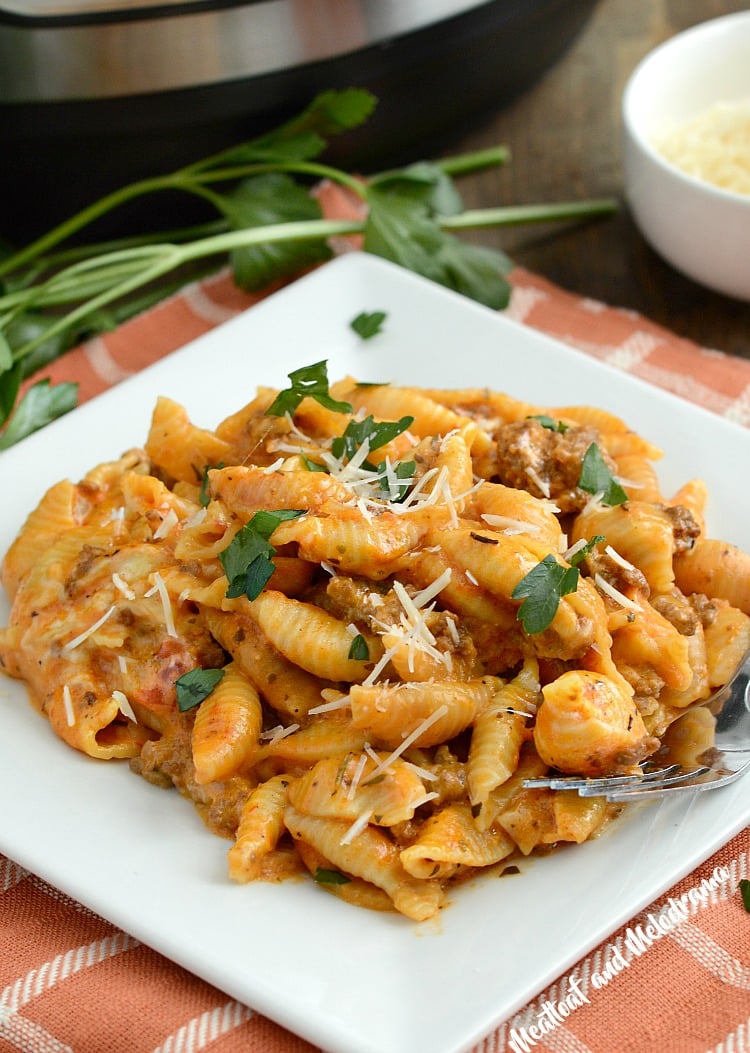 instant pot creamy shells and beef on a plate with parsley