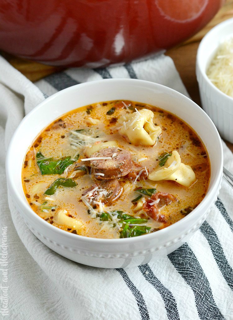 easy chicken sausage tortellini soup with spinach in white bowl