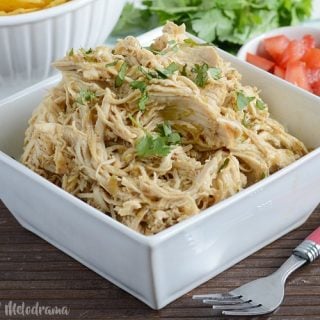 shredded instant pot salsa verde chicken in serving bowl