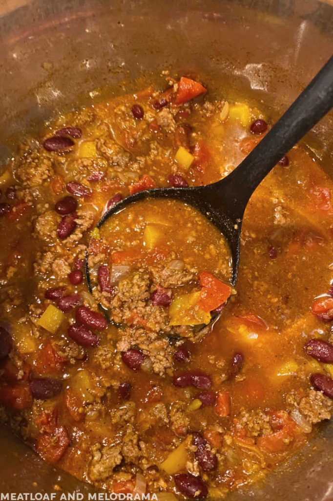 ladle with chili in the instant pot