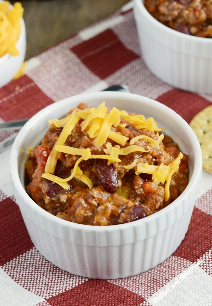 mom's best instant pot chili recipe topped with cheddar cheese