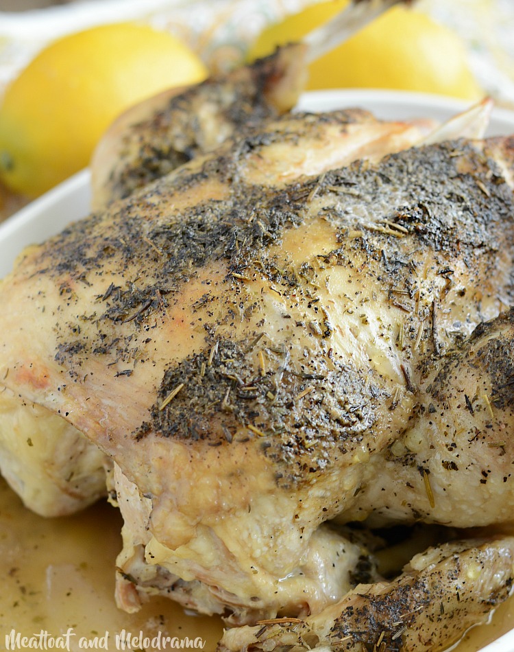  whole chicken with lemon garlic and herbs in serving dish