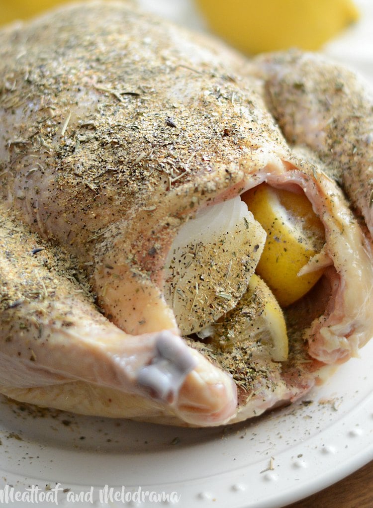 whole chicken rubbed with herbs and stuffed with onion and lemon
