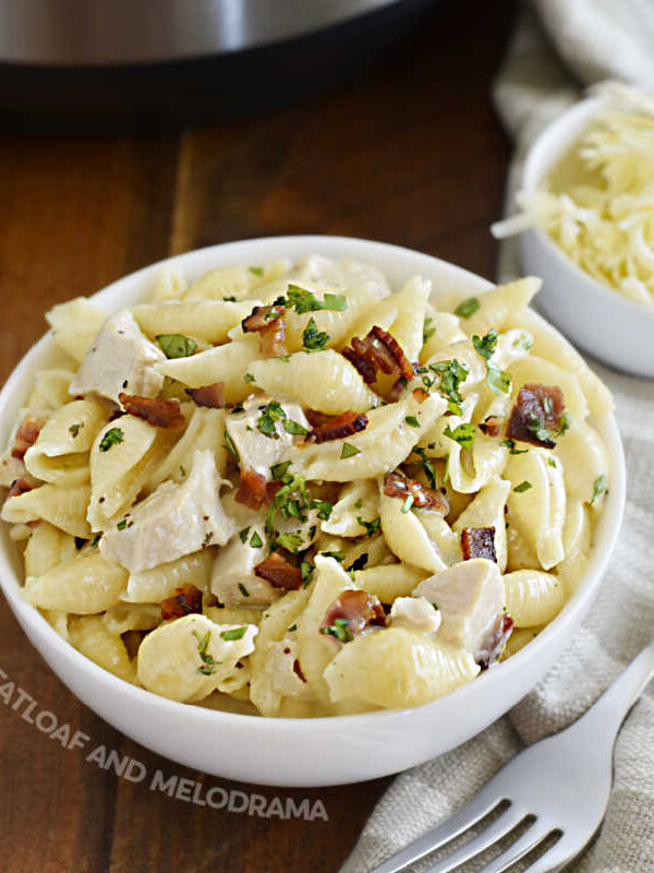 instant pot creamy chicken bacon ranch pasta in bowl with parsley on top